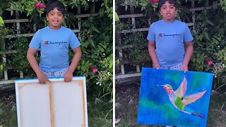 Kid shows off his beautiful hummingbird artwork