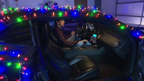 Too much holiday cheer? Car covered in holiday lights pulled over