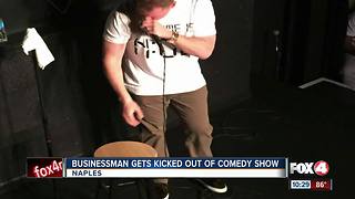 business man gets kicked out of comedy show