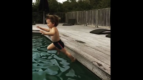 Little kid falls into pool in epic slow motion