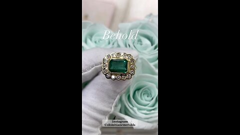 5.45tcw vivid green emerald + scalloped diamond halo in a chic 18K, royal yellow gold bezel setting