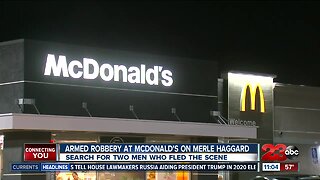Search for two men wanted for armed robbery at McDonald's