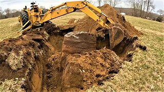 Burying a BIG ROCK with an Old Backhoe | John Deere 2010