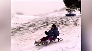 Man Runs To Catch A Girl On A Sled But Falls Down The Hill