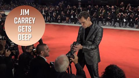 Jim Carrey kisses photog's camera, gets deep on acting