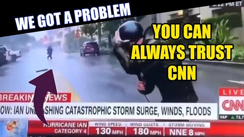 CNN Journalist Fighting The Hurricane As Man Calmly Walks By