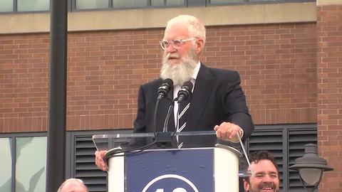 David Letterman jokes with the crowd during the Peyton Manning statue unveiling in front of Lucas Oil Stadium