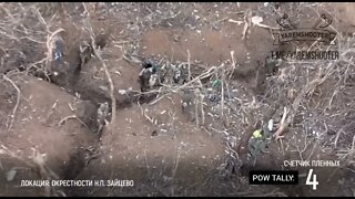Russians take Ukrainian POW's in the trenches..