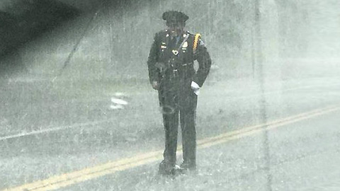 Officer Stands In Pouring Rain To Help Protect Little Snapping Turtle