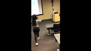 Students surprise professor with cake & card