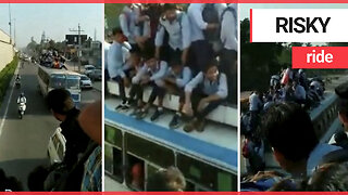 Worrying footage shows kids taking the bus to school - by sitting on the roof