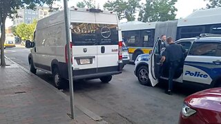 Boston police moving along two illegally parked Motor Vehicles