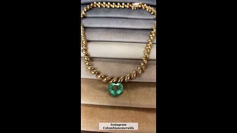 10 ct vibrant bubbly rare green loose Colombian emerald showcased on necklace chain jewelry ideas