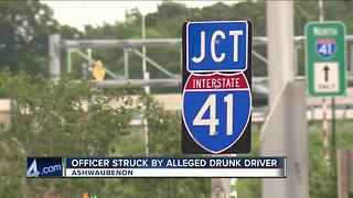 Officer hit by alleged drunk driver while assisting on a crash on I-41