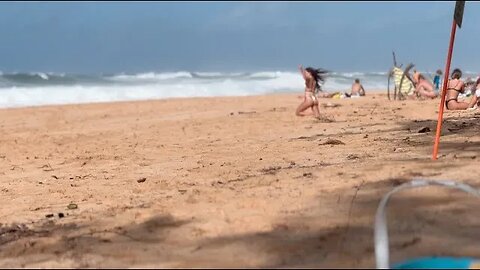 Hawaii beach at Pupukea area, strong wind, and ocean waves between rock piles and Ke Iki beaches.