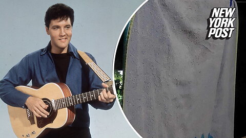 Couple spots face of Elvis on beach towel