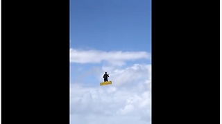 Kitesurfer makes insanely huge jump on windy day