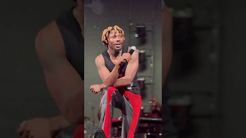 Asake performing_lonely at the top