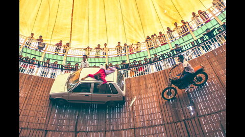 Vehicles Ride At High Speed On Walls In The "Well Of Death"