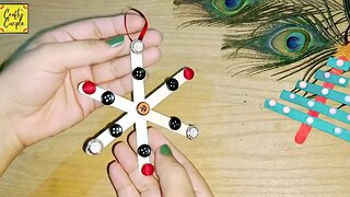 Easy Snowflake with ice cream sticks and waste buttons@Craftycouple1