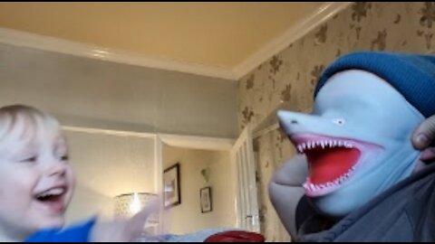 Father Wears Shark Mask On Face To Play With Son