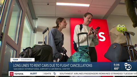 Long lines to rent cars due to flight cancelations