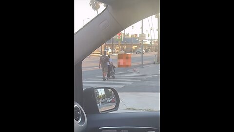 Family walks by naked person in Hollywood