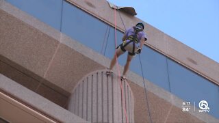 People rappel down West Palm Beach building for fundraiser