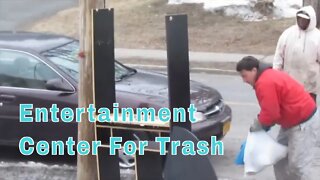 Garbage Men Pick Up An Entertainment Center