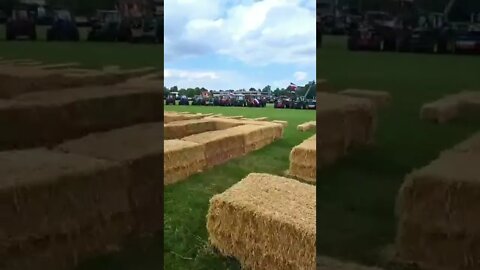 The huge SOS made from Dutch farmer haybales along the route of La Vuelta cycle race seen from