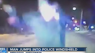 Man jumps onto windshield of police cruiser on NYE