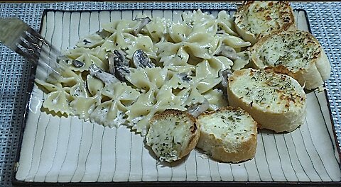 Creamy Mushroom Garlic sauce over bowtie pasta & cheesy bread