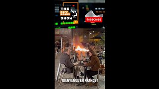 French diners sip wine as fires break out in protest against Macron