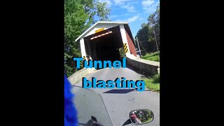 Motorcycle Tunnel blasting: two bikes: one bridge