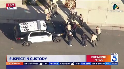 Los Angeles police officers pursue carjacking suspect