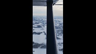 snowmobiles on a frozen lake