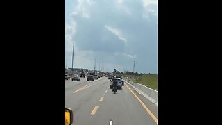 Cyclist Riding Bike On Highway 401