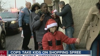 Officers take kids Christmas shopping in their police cruisers