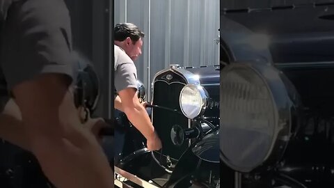 Crank start an antique car BY HAND?