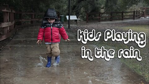 Kid Playing and splashing in the rain