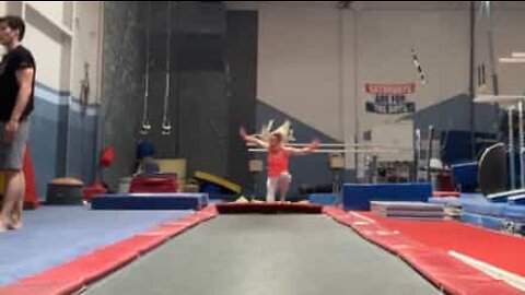 Gymnast "disappears" into pit