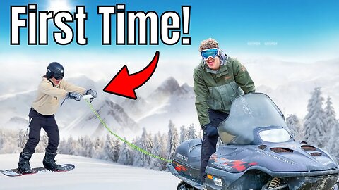 Taking Beginner Snowboarding Behind Snowmobile! (He Crashes)