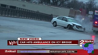 Car hits ambulance on icy bridge