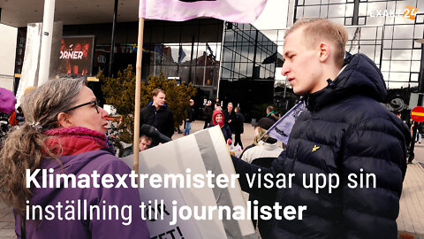 Klimatextremister visar upp sin inställning till journalister