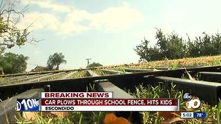 Car plows through North County school fence, hits kids