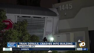 Train derails, hits building in South Bay