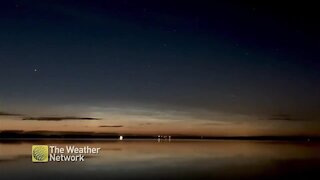 Peaceful time lapse of a cloud formation moving across the night sky
