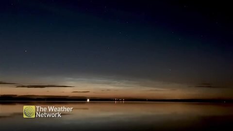 Peaceful time lapse of a cloud formation moving across the night sky