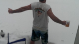 Man Pretends It's Summer During Snow Storm