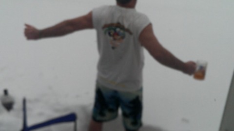 Man Pretends It's Summer During Snow Storm